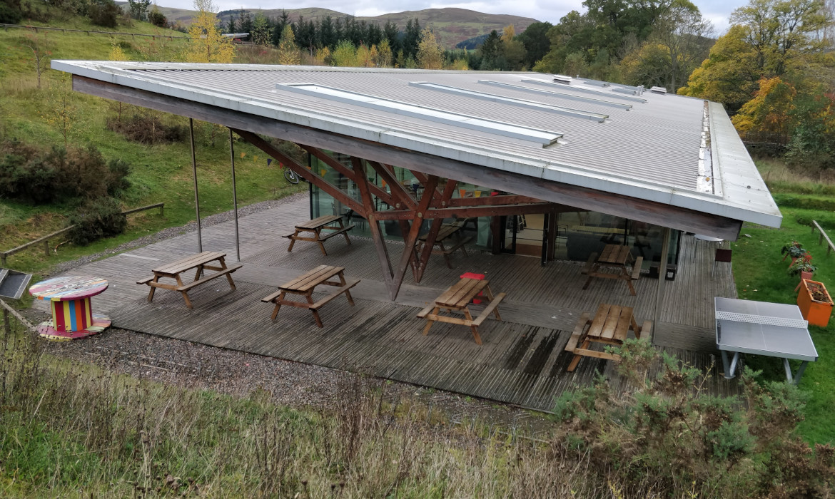 view down towards modern cafe building with monopitch roof